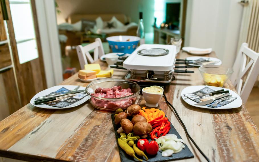 Raclette table set for New Year’s Eve .