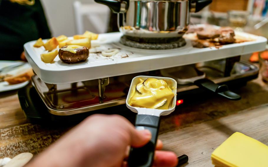 Melting cheese under the raclette grill.