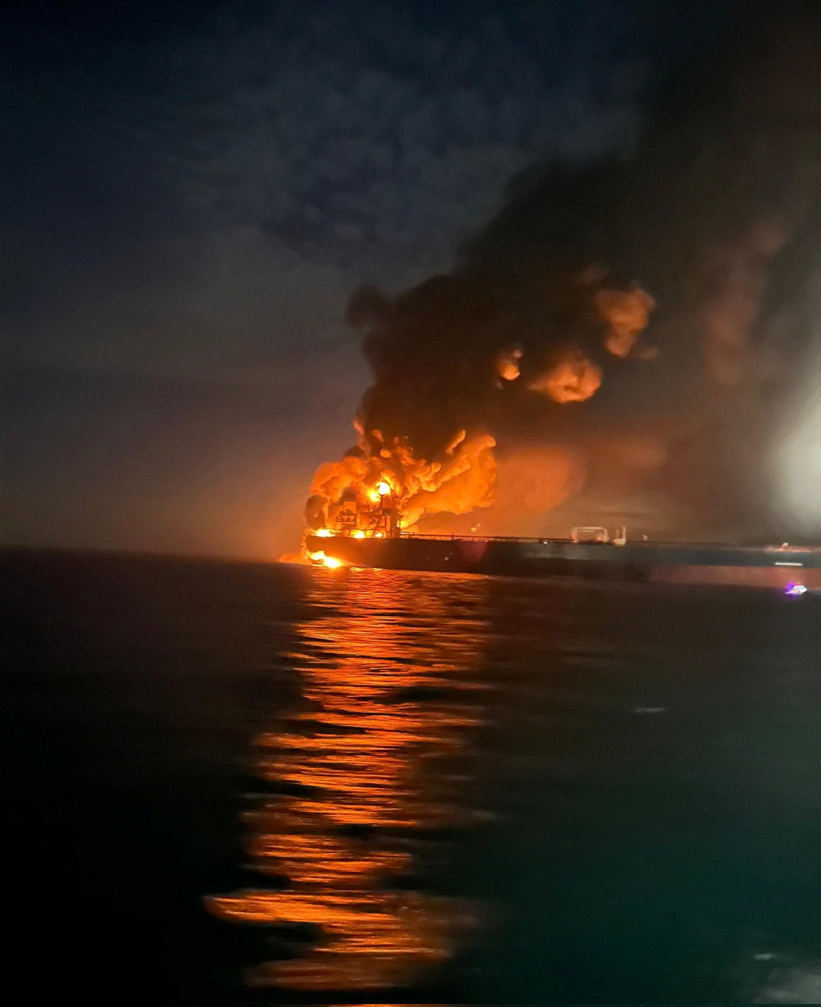 Flames and thick smoke rise from a tanker after blasts rocked two vessels from Russia's shadow fleet in the Black Sea near Turkey