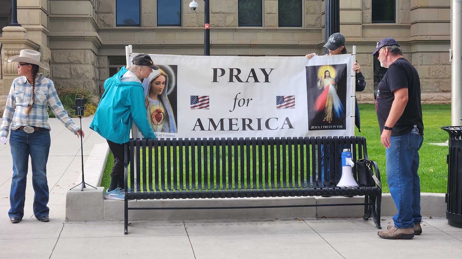 About 100 people gathered at the Wyoming Capitol in Cheyenne on Saturday evening to mourn and honor conservative political influencer Charlie Kirk, who was gunned down Wednesday. They also wept and prayed for Colorado school shooting victims.