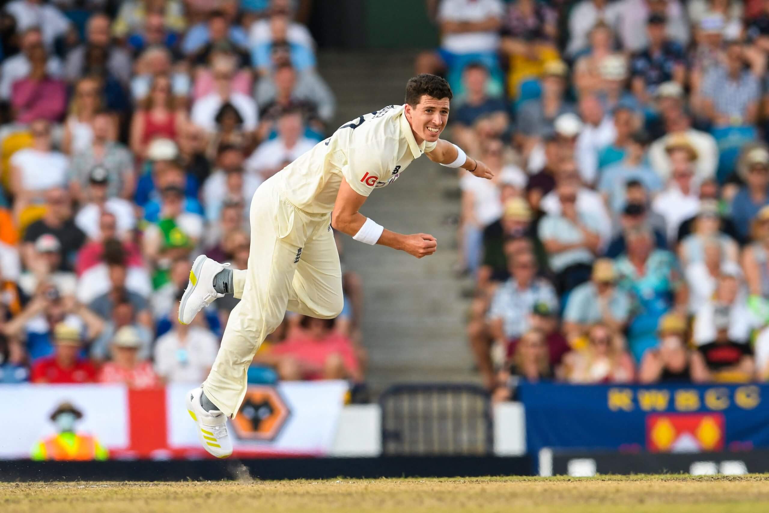 Matthew Fisher bowling on his England debut against the West Indies in Barbados