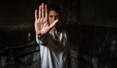 Close-up of a young man making a stop gesture