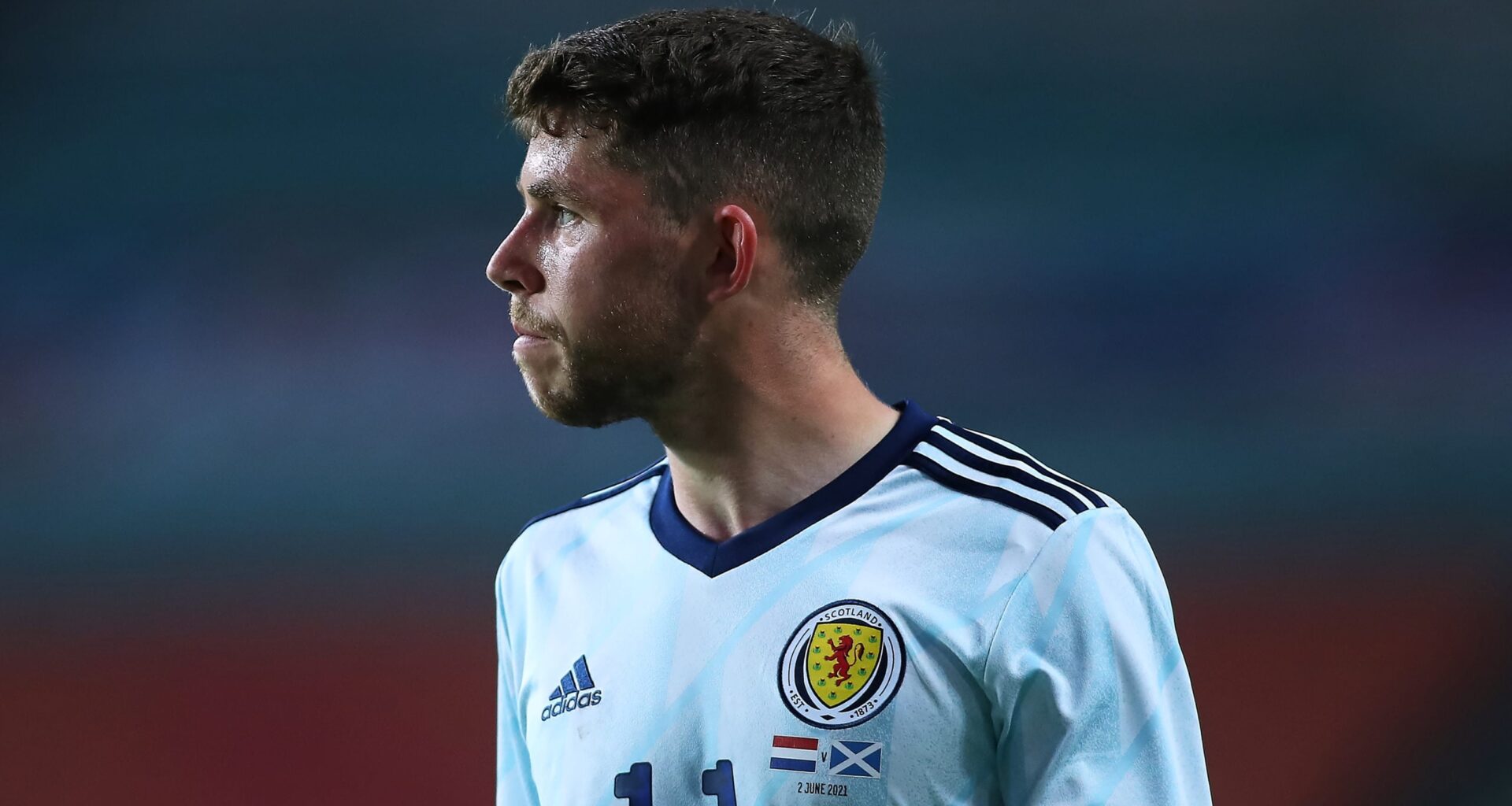 Ryan Christie shows off Celtic jerseys as he reacts to Scotland's 2026 World Cup draw