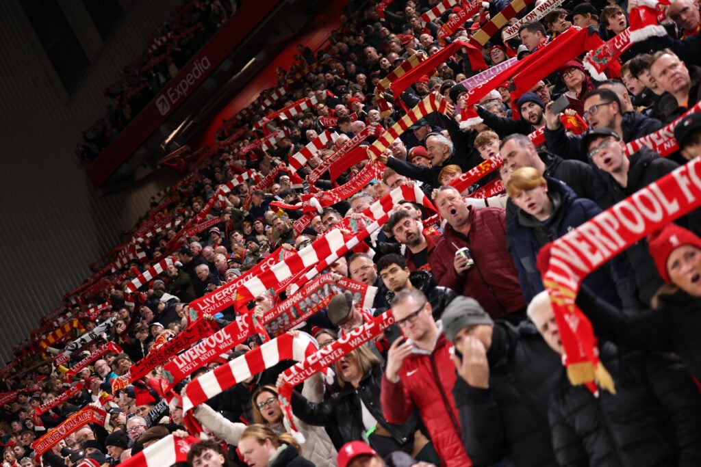 Liverpool fans raise scarfs at Anfield