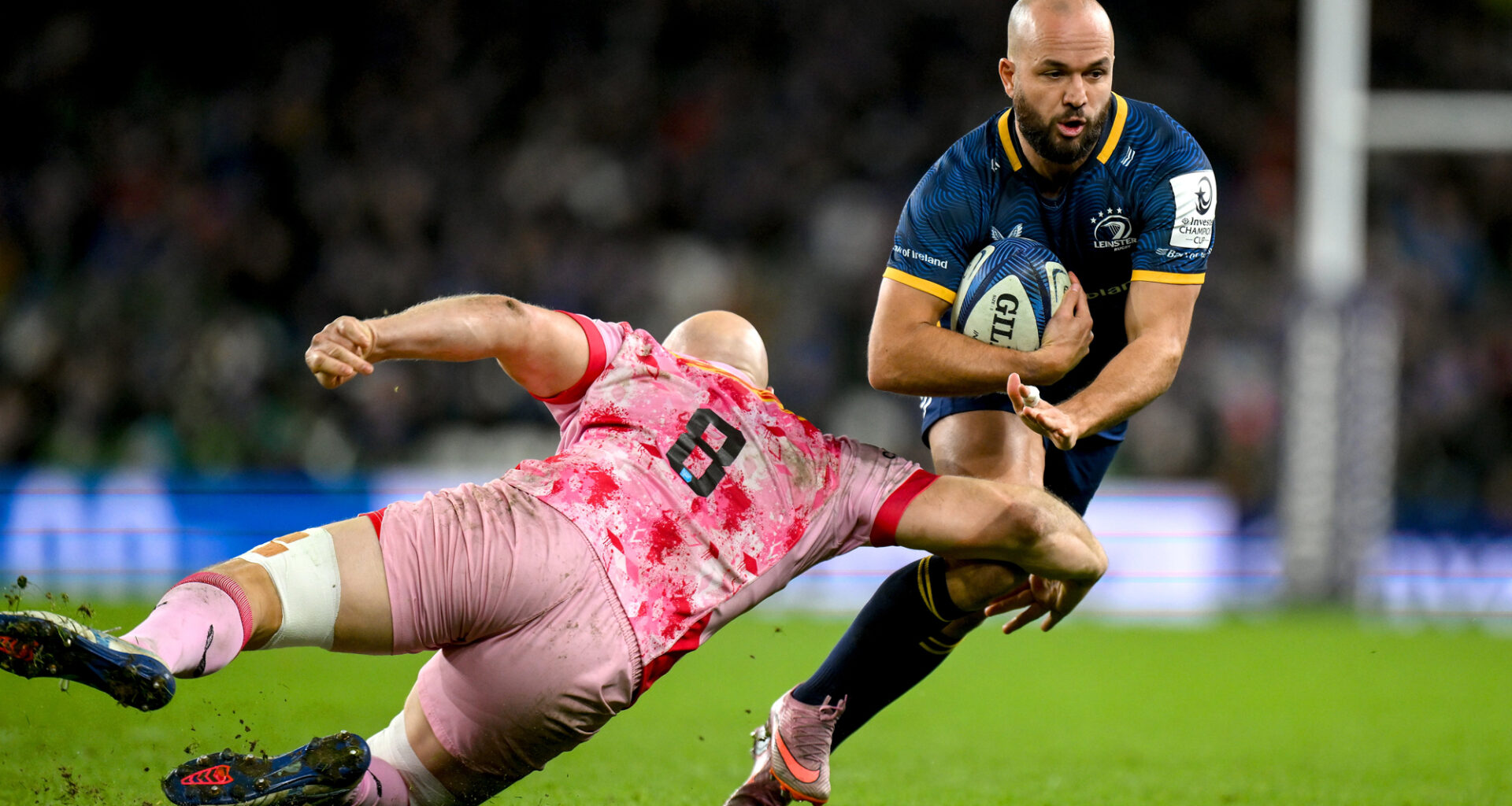 Tom Lawday of Harlequins tackles Jamison Gibson-Park of Leinster during the December 2025 European Champions Cup match