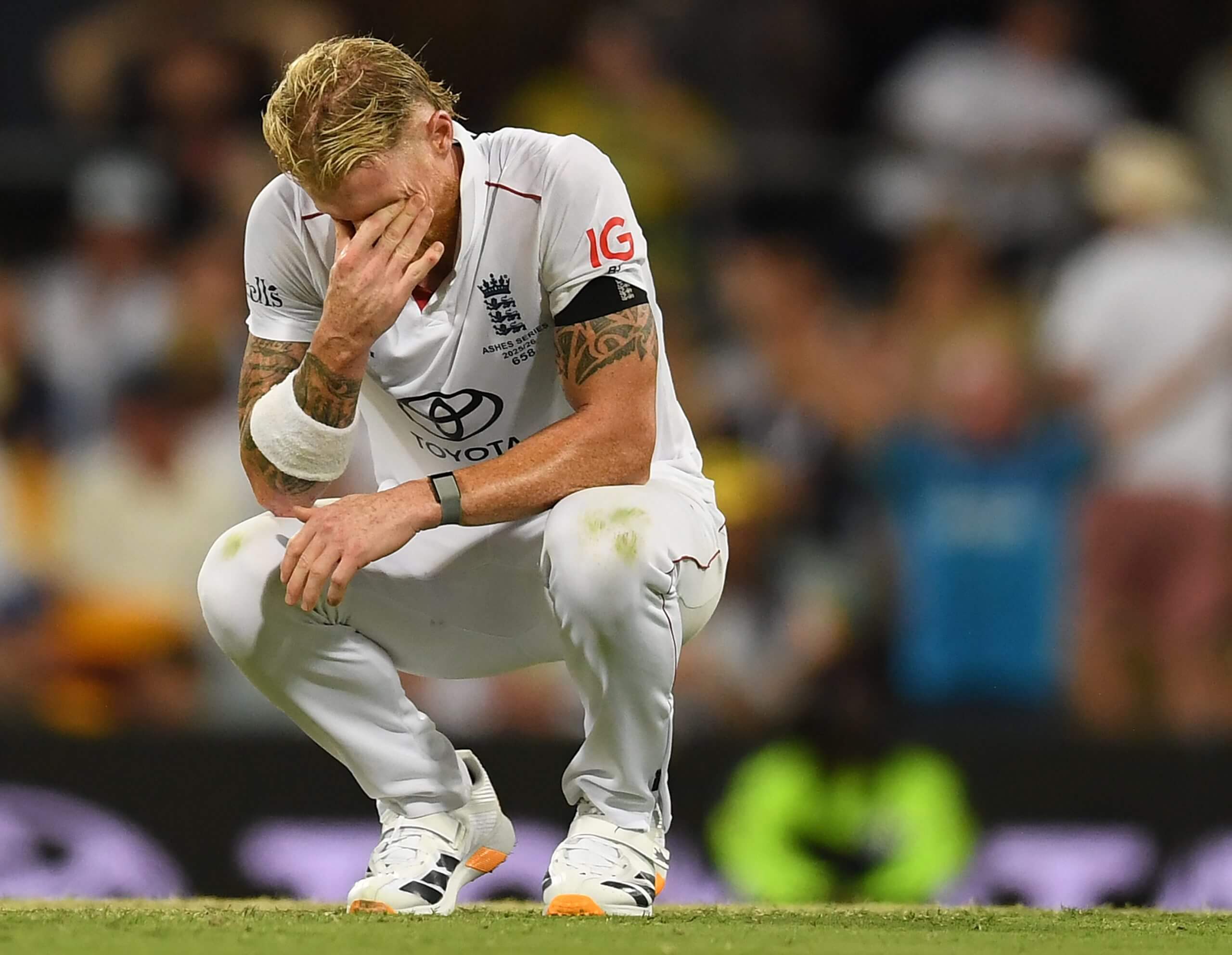 Ben Stokes, on his haunches, shows the strain