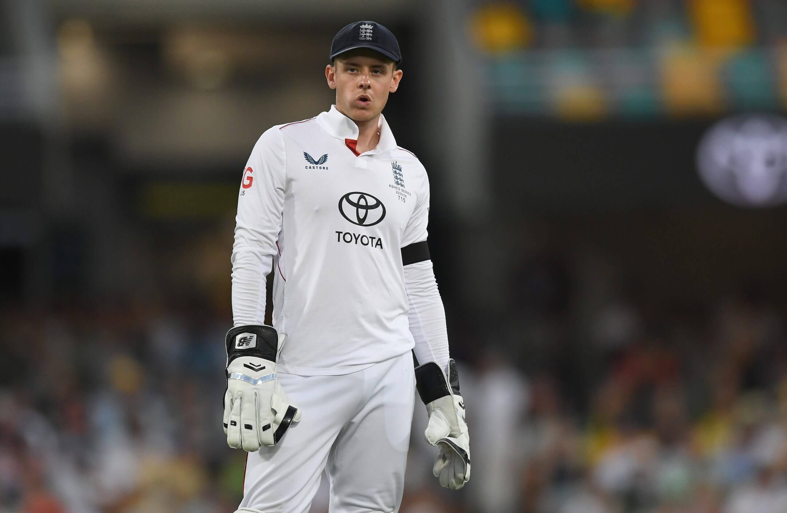 A rueful Jamie Smith looks on as England labour