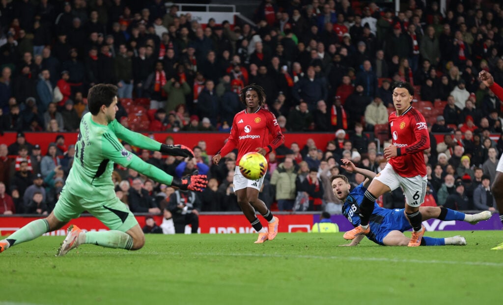 Senne Lammens makes a save from David Brooks during the Premier League match between Manchester United and Bournemouth at Old Trafford in 2025 in Manchester, England.