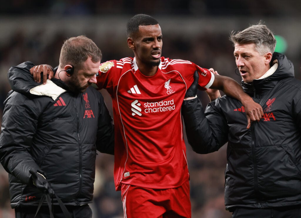 Alexander Isak is helped off the field after picking up an injury after scoring for Liverpool against Tottenham