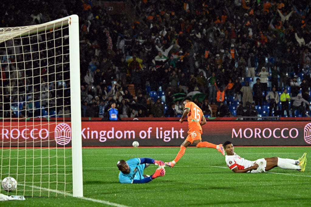 Ivory Coast's forward #15 Amad Diallo (C) celebrates scoring the team's first goal during the Africa Cup of Nations (CAN) Group F football match between Ivory Coast and Mozambique at Marrakesh Stadium in Marrakesh on December 24, 2025