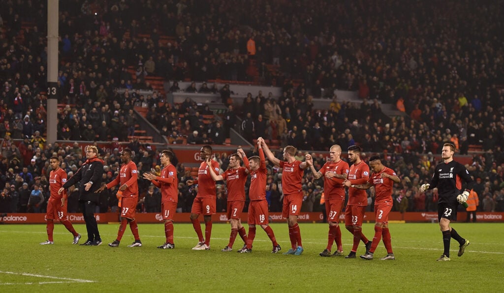 Liverpool players celebrate draw v West Brom.