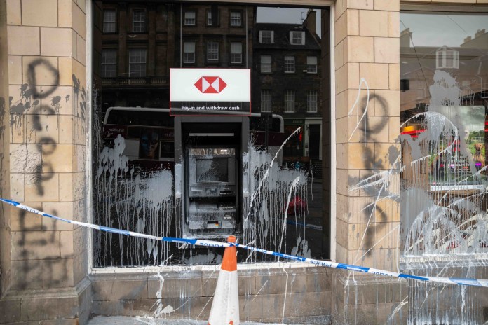 Pictures posted by edinastine, who was alerted to the incident by The Aftershock, following the incident show writing on the wall of the HSBC branch which reads "drop Elbit". (C) @edinastine / Instagram