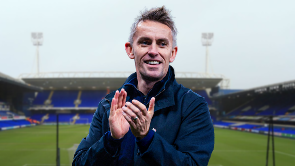 Kieran McKenna clapping in front of Ipswich home ground