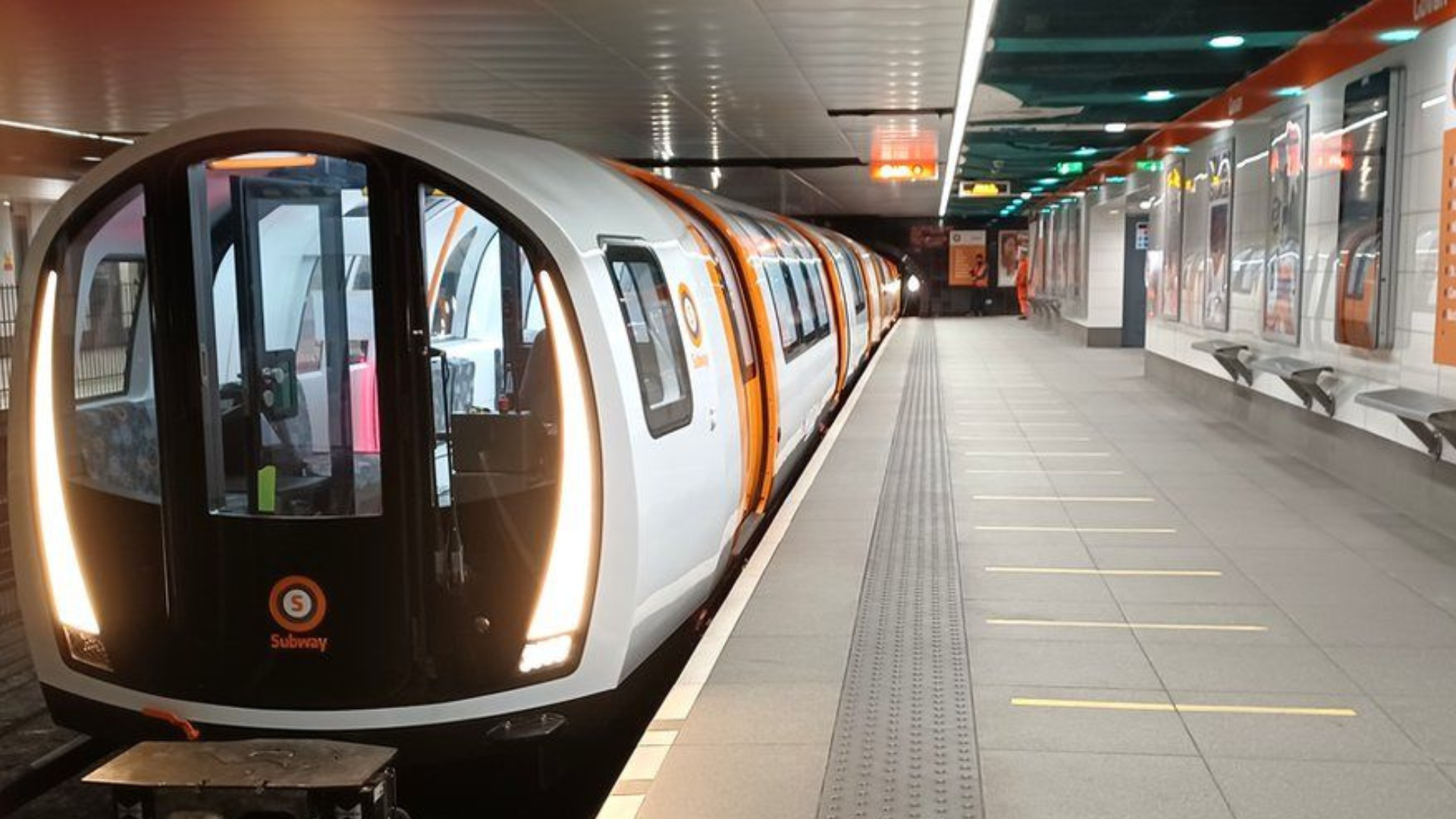 A subway train at a station.
