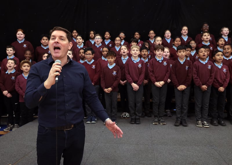 Malachi Cush leads the choir of St Patrick’s Primary School, Dungannon, one of the North’s most diverse primary schools. PICTURE: BRIAN LINCOLN