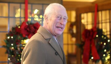 King Charles wearing a tan coat at Christmas time