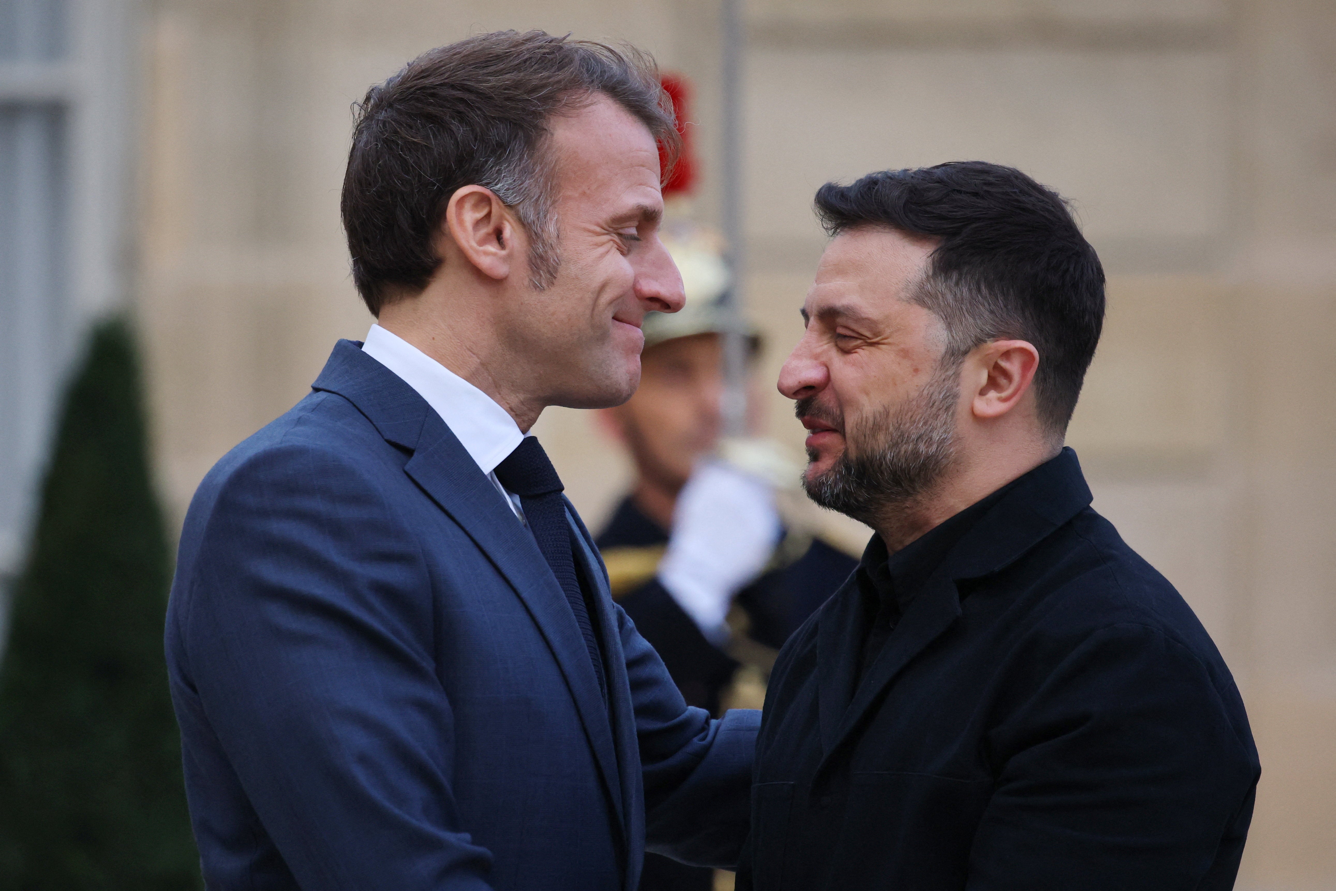 French president Emmanuel Macron welcomes Ukrainian president Volodymyr Zelensky as he arrives for a meeting at the Elysee Palace in Paris
