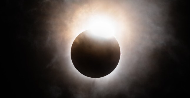 BRADY, TEXAS - APRIL 08: The moon begins its descent below the sun's horizon during a total solar eclipse on April 08, 2024 in Brady, Texas. Millions of people have flocked to areas across North America that are in the "path of totality" in order to experience the eclipse today. During the event, the moon will pass in between the Sun and the Earth, appearing to block the Sun. (Photo by Brandon Bell/Getty Images)
