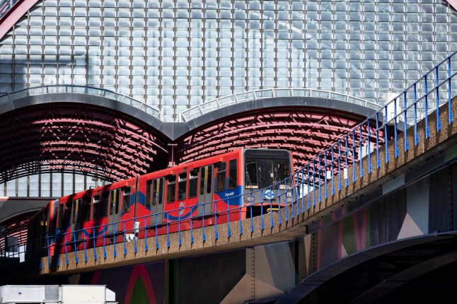 DLR train on elevated tracks in London.
