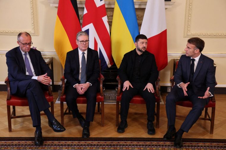 (L-R) Germany's Chancellor Friedrich Merz, Britain's Prime Minister Keir Starmer, Ukraine's President Volodymyr Zelensky and France's President Emmanuel Macron sit down ahead of a meeting inside 10 Downing Street in central London on December 8, 2025. (Photo by Adrian DENNIS / POOL / AFP via Getty Images)