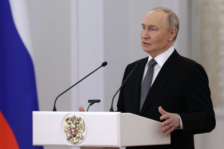 Russian President Vladimir Putin speaks prior to the awarding ceremony for Russian heroes, military and civilian, marking Heroes of the Fatherland Day, at the Kremlin in Moscow, Tuesday, Dec. 9, 2025. (Gavriil Grigorov, Sputnik, Kremlin Pool Photo via AP)