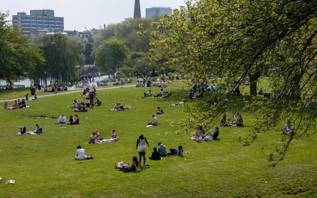 BRISTOL, UK - 11th MAY 2024 - Scenic landscape of people enjoying the outdoors in Castle Park on a sunny late spring day in Bristol, England, United Kingdom, Europe