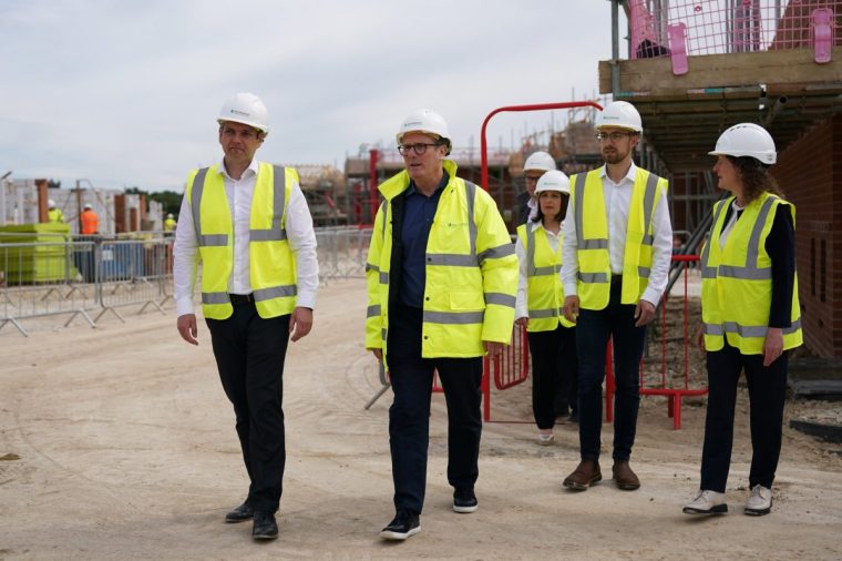 YORK, ENGLAND - JUNE 20: Labour leader Sir Keir Starmer visits the construction site of Persimmon Homes Germany Beck housing development on June 20, 2024 in York, United Kingdom. Labour pledges to build 1.5 million new homes over the next parliament by supporting housing associations to enhance their capacity for affordable housing, setting mandatory housing targets for councils, and recruiting hundreds of new planners to address planning backlogs. (Photo by Ian Forsyth/Getty Images)