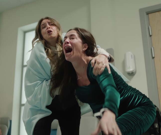 Charity supports Shona as she screams in pain in Corriedale