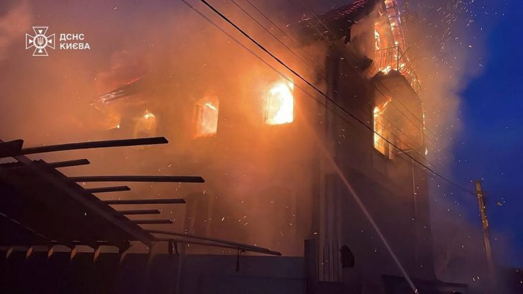 This handout photograph taken and released by the Ukrainian Emergency Service on December 27, 2025, shows a building damaged during a Russian drone and missile attack in Kyiv, amid the Russian invasion of Ukraine. Several powerful explosions rocked Kyiv on December 27, 2025 as authorities warned that the Ukrainian capital was under threat of missile attack. (Photo by Handout / UKRAINIAN EMERGENCY SERVICE / AFP via Getty Images) / RESTRICTED TO EDITORIAL USE - MANDATORY CREDIT 