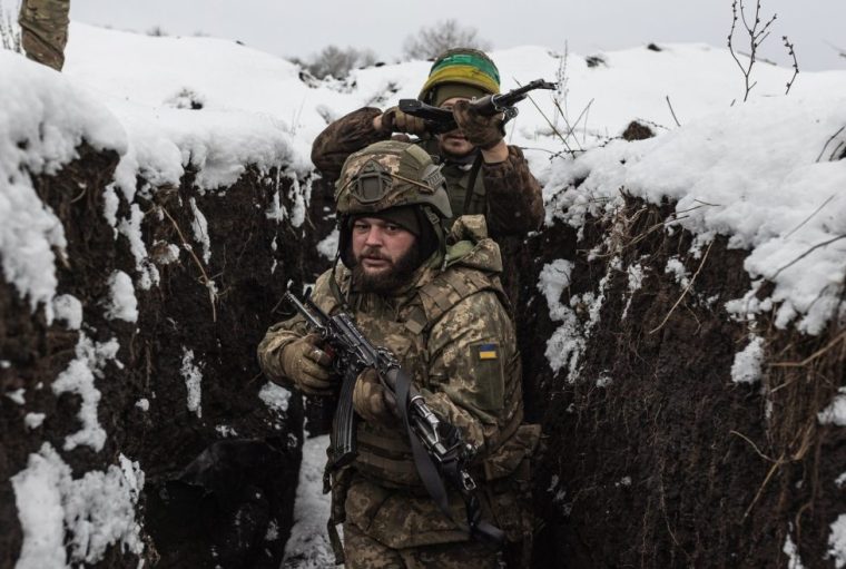 KHARKIV OBLAST, UKRAINE - DECEMBER 27: Ukrainian infantry soldiers from the 156th Brigade train at a snow-covered training ground in the Kharkiv Oblast, Ukraine, 27 December 2025. (Photo by Diego Herrera Carcedo/Anadolu via Getty Images)