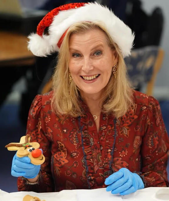 Sophie, The Duchess of Edinburgh holds a biscuit decorated as Rudolf the red nosed Reindeer
