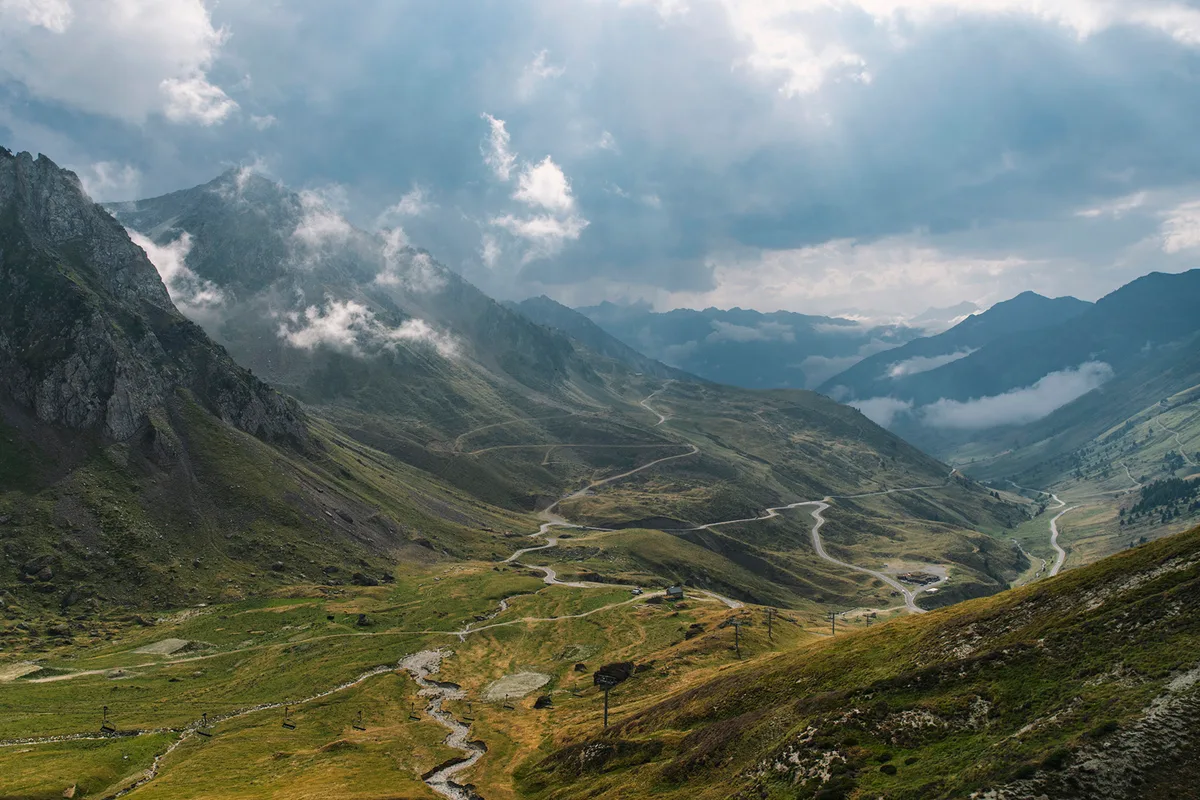 View down over the valley to the west from the Col du Tourmalet, French Pyrenees, as storm clouds start to gather.