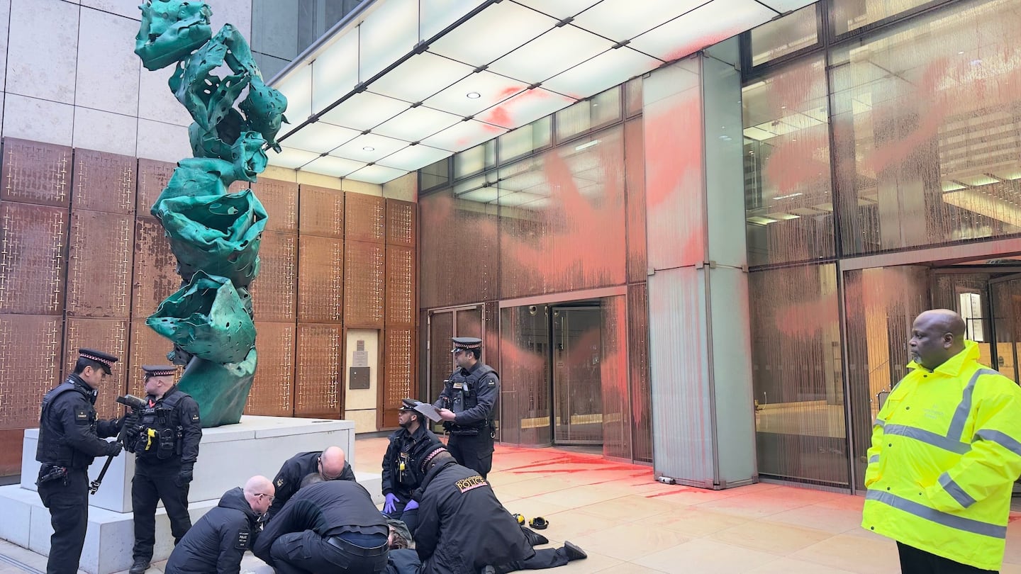 The scene at Aspen Insurance at Plantation Place in the City of London, after two activists sprayed red paint over the front of the building, in support of the Palestine Action protesters on hunger strike in prison, Tuesday, Dec. 23, 2025.