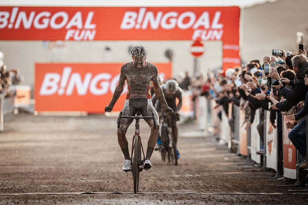 Belgian Michael Vanthourenhout celebrates as he crosses the finish line to win the men's elite race of the Cyclocross World Cup, in Terralba, Sardinia, Italy, Sunday 07 December 2025, stage 3 (out of 12) in the World Cup of the 2026-2027 season. BELGA PHOTO DAVID PINTENS (Photo by DAVID PINTENS / BELGA MAG / Belga via AFP)