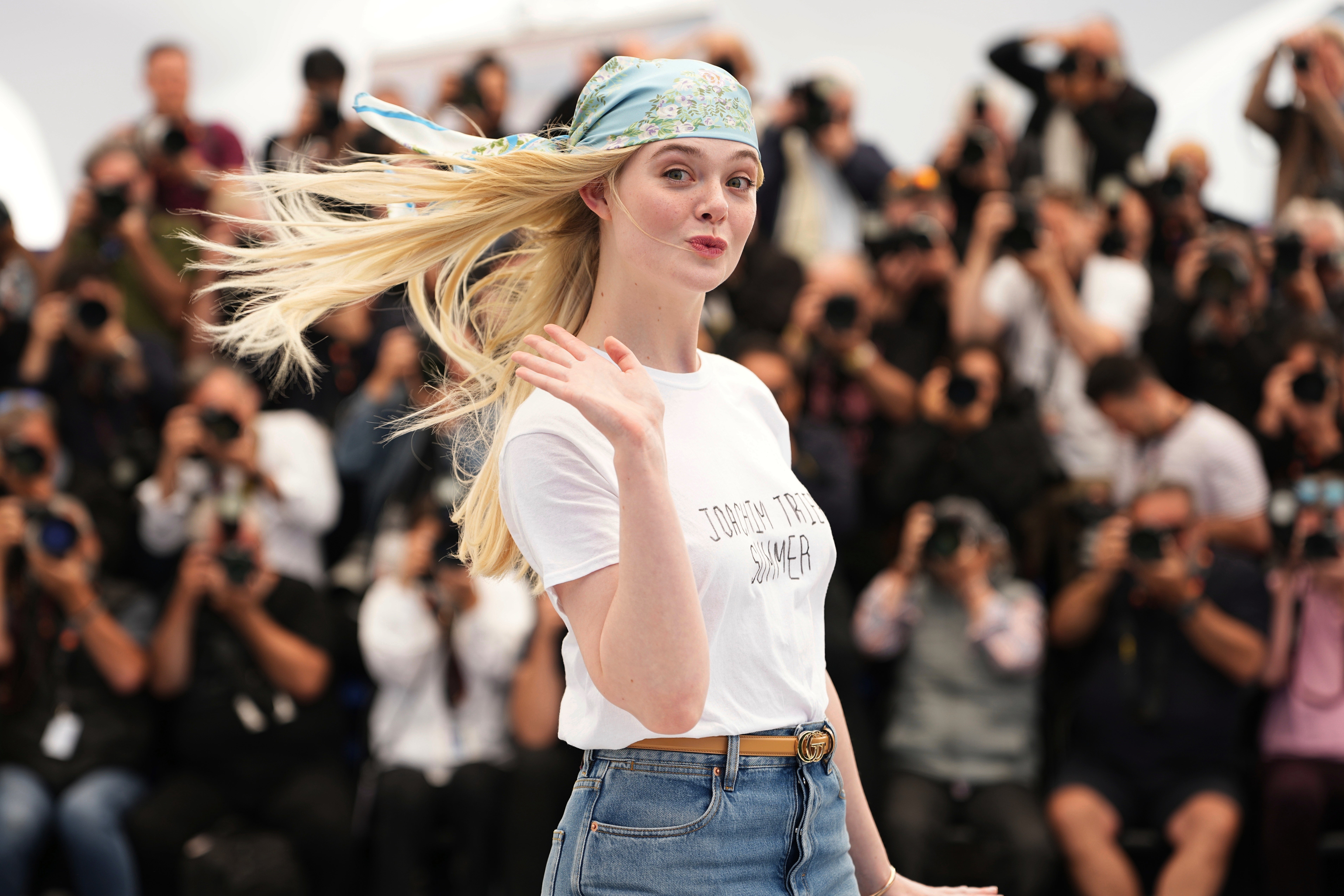 Fanning poses in a ‘Joachim Trier Summer’ T-shirt at the Cannes festival