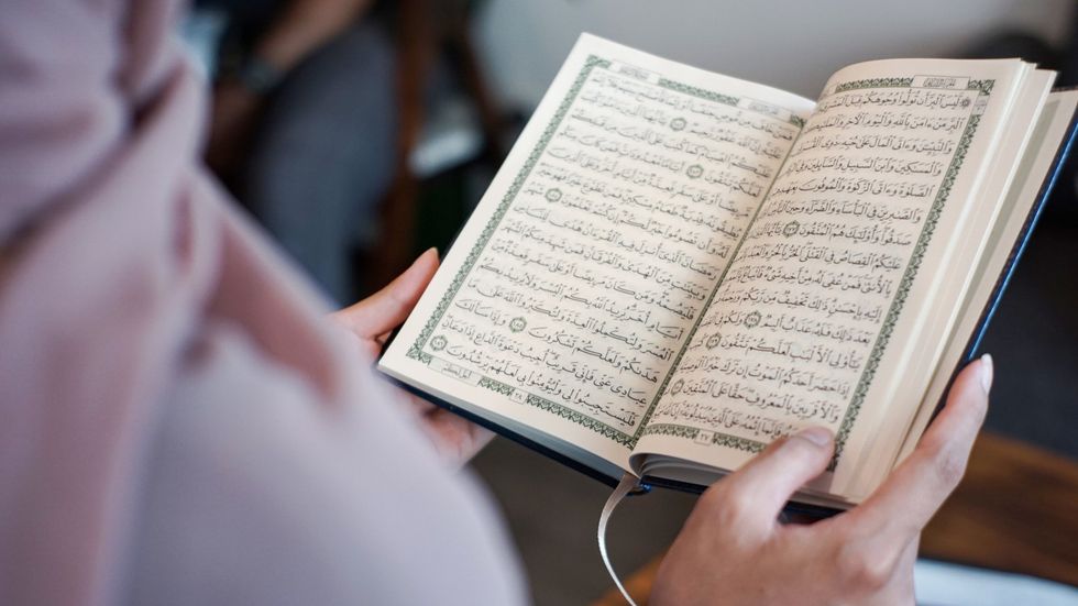 A woman reading the Koran