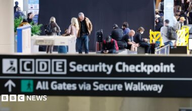 Passengers pass through the Transportation Security Administration (TSA) security checkpoint at San Francisco International Airport