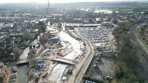 A drone image can be seen overlookng the city of Salisbury as flood defence works are carried out either side of the River Avon. 