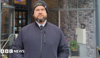 Martin Griffiths, wearing a wool hat and a jacket, standing with his hands in his pockets in front of the High Street Feeder cafe, near where the incident took place.