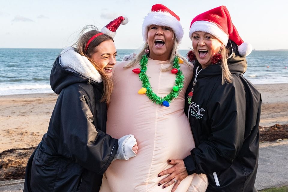 Shannon Johnson, Karen Millar and Nikki Watson at the Christmas Eve dip at Helen’s Bay on 24th December 2025 (Luke Jervis/Belfast Telegraph)
