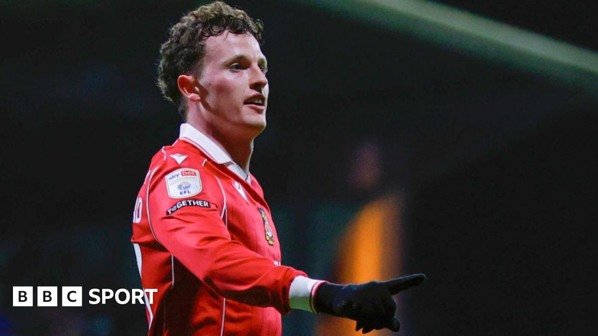Wrexham forward Nathan Broadhead celebrates