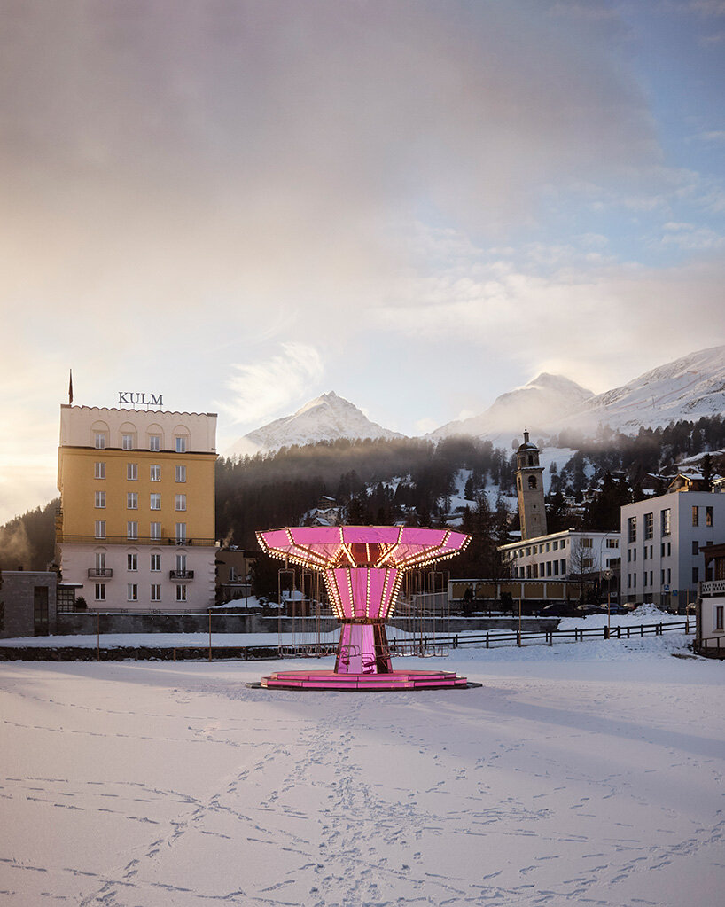 carsten höller's pink mirrored carousel slows time on the ice rink of the kulm hotel st. moritz