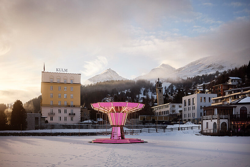 carsten höller's pink mirrored carousel slows time on the ice rink of the kulm hotel st. moritz