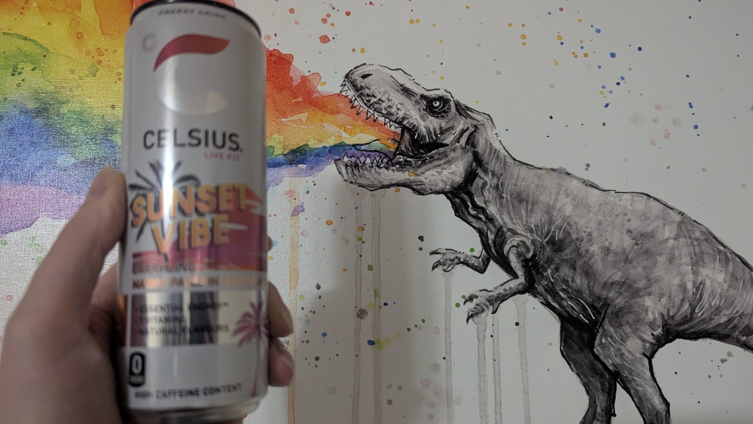 Celsius can in front of dinosaur painting