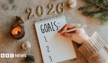 Woman's hand writing goals 2026 for New Year. New Year Routine