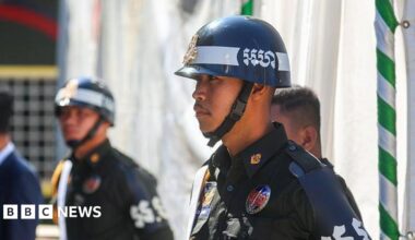 Cambodian military police officers stand guard