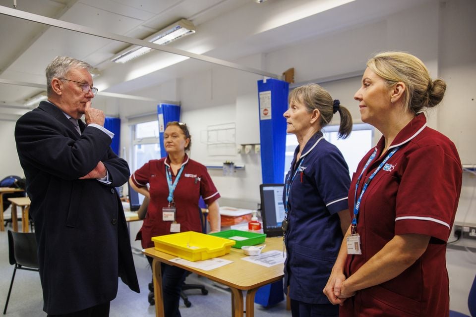 Health Minister Mike Nesbitt with vaccinators Lorraine, Oriel and Claire at the Ulster Hospital Vaccination Centre in Belfast (Liam McBurney/PA)