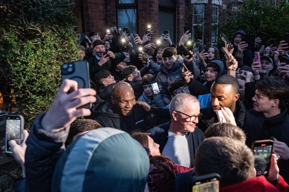 A large crowd gathered outside the property