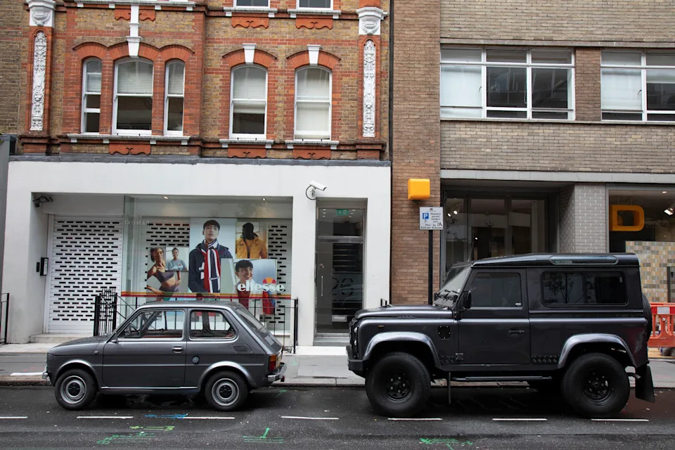 A small Fiat 126 car and a large Land Rover Defender on the streets of London. (photo by Mike Kemp/In Pictures via Getty Images)
