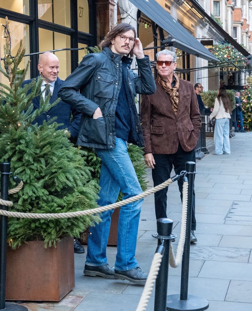 Pierce Brosnan in brown blazer with his son Dylan in jeans and leather jacket  in London